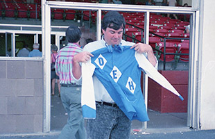 Jim holding up the silks of his DEH Racing Stable